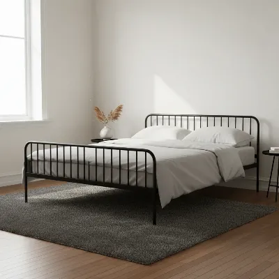 A modern bedroom with a sleek black metal bed frame, contrasting with warm wooden floor and neutral walls