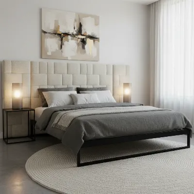 Elegant upholstered headboard in a modern bedroom with a metal bed frame.